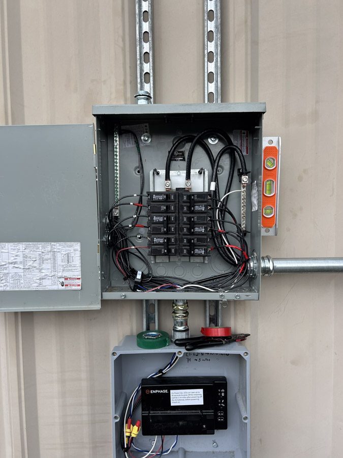 Open residential electrical panel with new breakers during a Joplin service upgrade